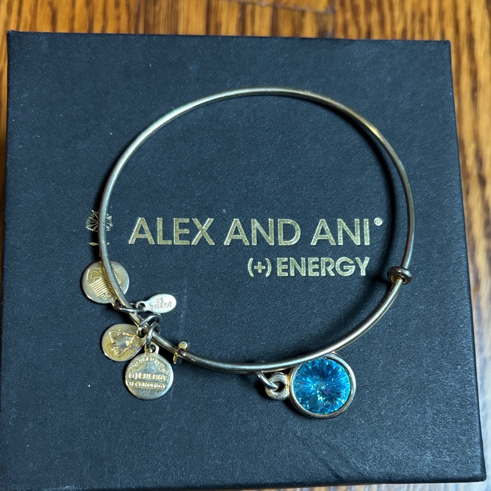 Alex and Ani Gold Bangle with Blue Charm
